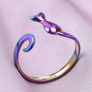 Macro shot of an adjustable minimalist cat ring with iridescent purple and blue finish