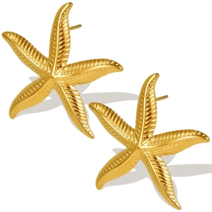 Macro shot of 18k gold plated stainless steel starfish stud earrings with textured detail