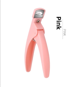 Close-up of pink professional U-shaped nail tip clipper with stainless steel blade and spring