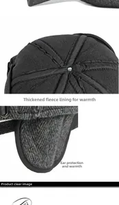 Close-up of winter earflap hat featuring thick fleece lining and grey herringbone fabric