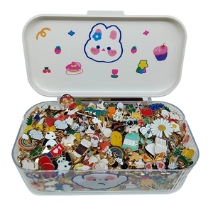 Cute enamel pins set with panda and strawberry motifs in a white cartoon storage box