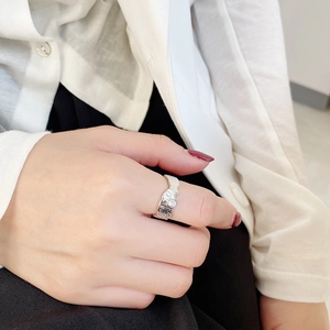 Detail of irregular textured S925 silver ring featuring a round sparkling zircon stone