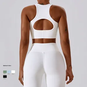 Women's white ribbed high-impact sports bra and leggings set with cutout back design