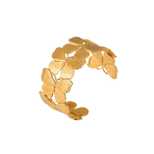 Exaggerated 18k gold plated stainless steel butterfly open cuff bracelet on white background