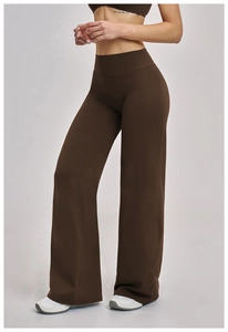 Close-up of high-waist wide-leg brown sports pants in high-stretch knitted fabric