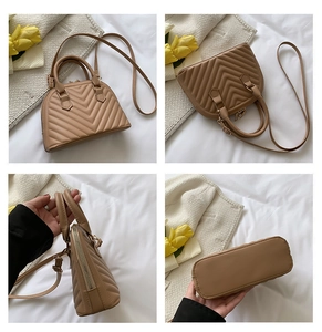Detailed views of the beige quilted shell handbag showing texture, zip, and base angles