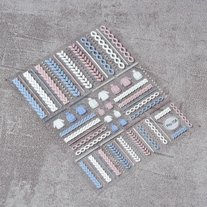 Macro view of 5D winter sweater knitting patterns and 3D textured nail stickers