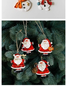 Detail view of 6-piece resin Santa and snowman hanging ornaments on a Christmas tree