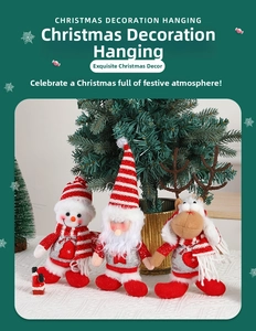 Detailed view of knitted Christmas dolls with sequins and Merry Christmas embroidery