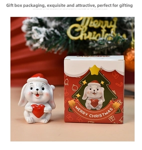 Cute resin Christmas bunny figurine with red hat and heart in a festive gift box