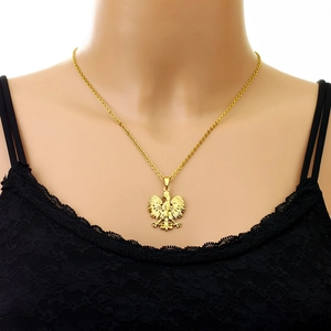 Detailed close-up of a golden Polish Eagle crest pendant on a stainless steel necklace chain