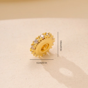 Macro shot of 8mm gold spacer bead with cubic zirconia and size dimensions labels