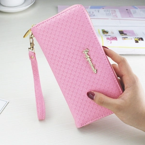 Pink long zip-around clutch wallet with cross-pattern texture and wristlet strap
