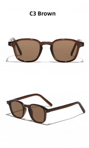 Detail view of tea-colored TR90 sunglasses with semi-transparent amber rectangular frame