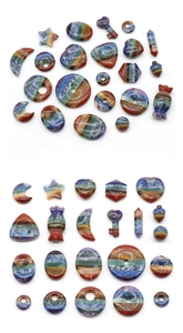 Macro display of diverse chakra healing stones in varied shapes with vibrant rainbow layers