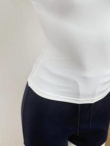 Detailed close-up showing the precise stitching and hem of the white slim-fit sports t-shirt