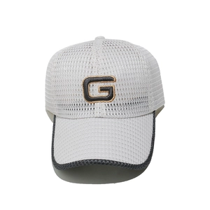 Close-up of white breathable mesh baseball cap featuring embroidered G letter logo detail
