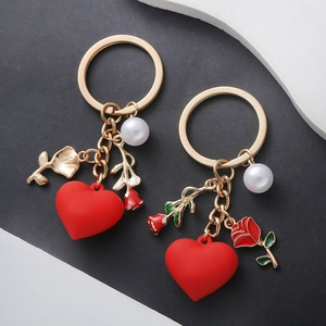 Cute heart rose and pearl pendants on golden metal keychains for bags and accessories