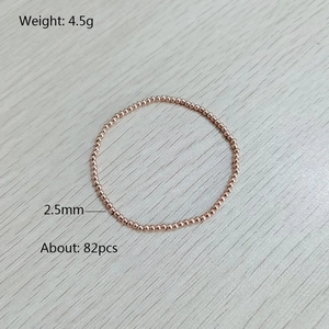 Detail of rose gold stainless steel elastic bracelet with 2.5mm polished beads