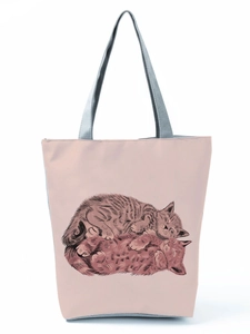 Close-up of the cat print and fine texture on a pink lightweight tote bag