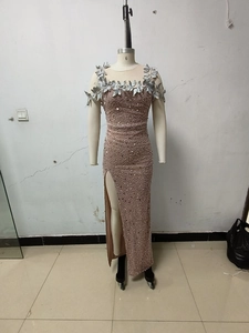 Detail of rose gold evening dress with sequins, silver leaf trim and high side slit