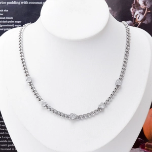 Elegant silver heart necklace with five sparkling pave pendants on a white mannequin