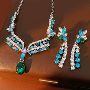 Detailed macro of vintage silver necklace and earrings with crystals in leather box
