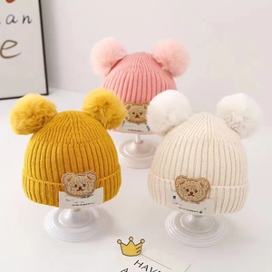 Toddler knitted winter beanies with pom-poms and cartoon bear patches in three colors