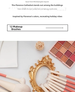 Flat lay of 12-piece peach makeup brush set with white travel pouch and eyeshadow palette