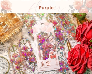 Detail of PVC flower bookmarks with vintage red rose designs and laser laser holographic foil
