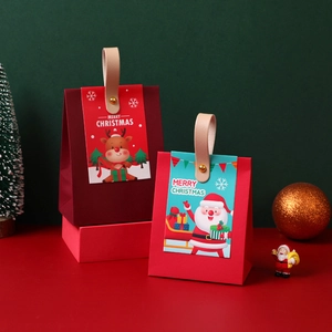 Christmas gift boxes with leather handles featuring Santa and reindeer cartoon patterns