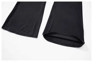 Detail of flared leg yoga jumpsuit showing neat stitching and high elasticity fabric