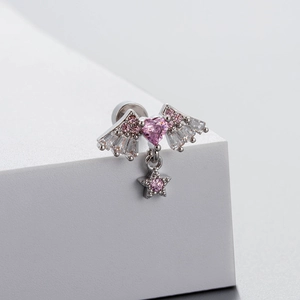 Silver angel wing earrings with pink heart zircon and hanging star on white pedestal