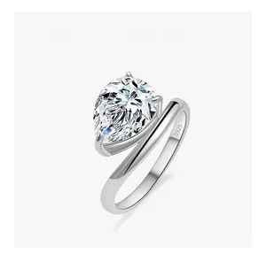 Detailed macro view of S925 silver ring featuring a pear-cut diamond and sleek curved band
