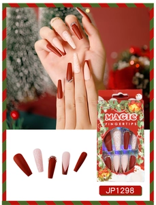 Detailed view of Christmas press on nails with snowflake patterns and crystal rhinestones