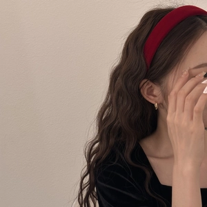 Elegant red velvet wide headband worn on model with vintage French style and golden earrings