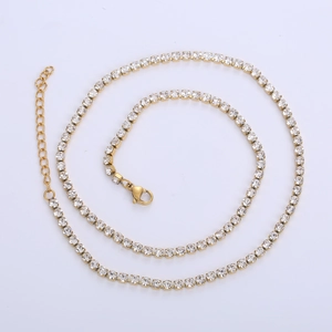 Detail of 4mm gold tennis chain featuring round cubic zirconia and lobster clasp