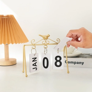 Golden metal bird desk calendar with manual flip cards for office or home decoration