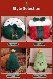 Detail of Christmas plush pillows showing textures of wreath, gift box, and tree styles