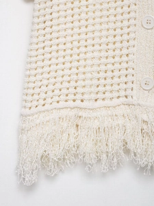 Détail de la texture en maille avec bordures à franges et motif ajouré élégant