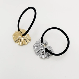 Punk style metallic shell alloy hair ties in gold and silver finish on black elastic