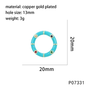 Detail of 20mm gold plated round pendant with light blue enamel and colorful zircon stones