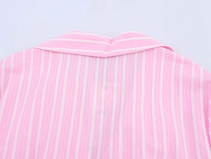 Detailed view of pink and white striped shirt neckline with high-quality stitching