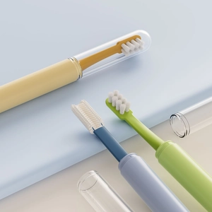 Portable pet toothbrush set with silicone bristles and dust covers in multiple colors