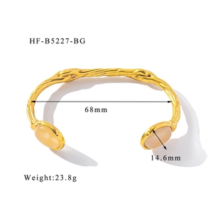 Detail shot of vintage 18K gold plated twisted bangle with yellow stone and dimensions