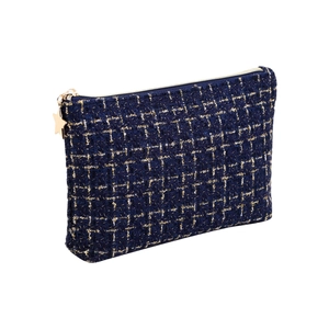 Elegant navy blue tweed makeup bag with gold star charm and premium gold zipper