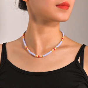 Bohemian handmade beaded necklace with lavender and multicolor accents on a model