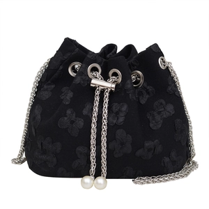Fashionable black drawstring bucket bag with 3D floral texture and pearl chain strap
