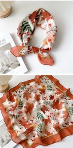 Detailed view of square cotton linen scarf with autumn maple leaf and berry patterns