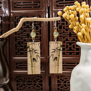 Elegant bamboo leaf long tassel earrings hanging on branch in vintage Chinese style